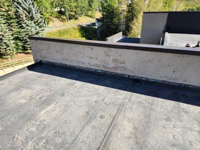 Commercial roof replacement by Custom Exteriors, flat roof
