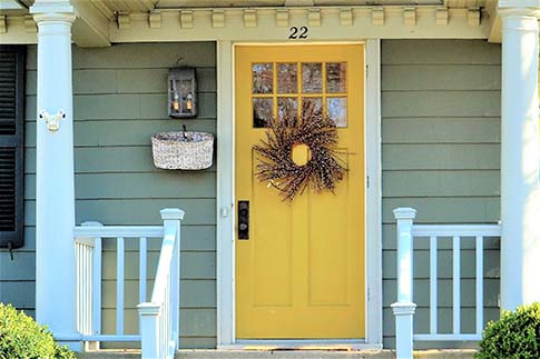 Craftsman style front door with a unique exterior paint job