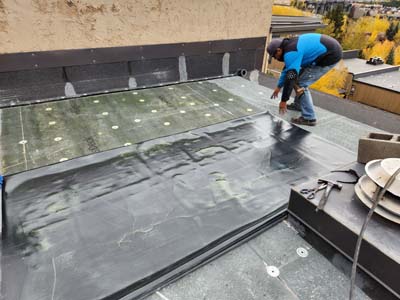 Commercial roof maintenance by Custom Exteriors