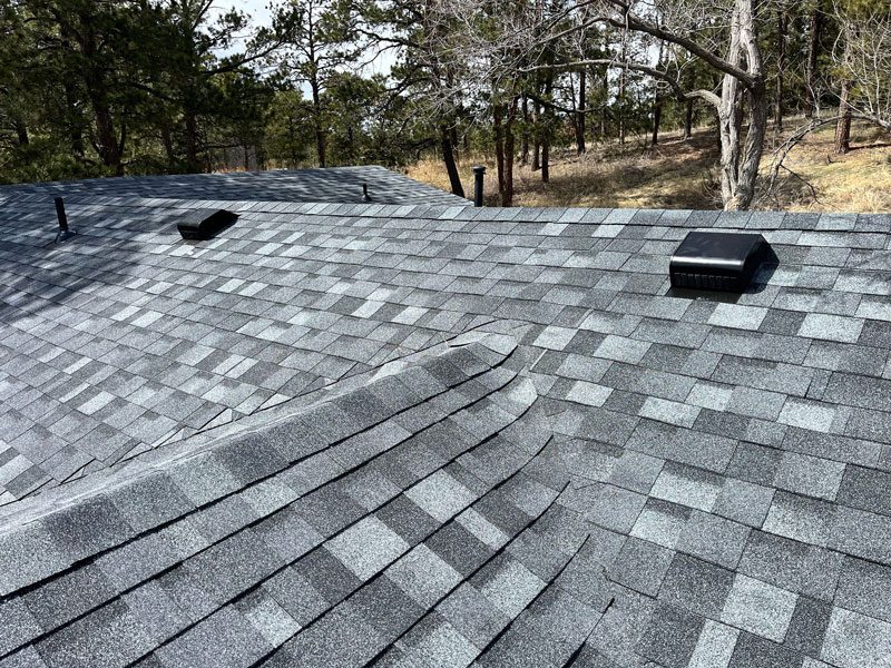 Residential roof maintenance by Custom Exteriors including roof inspections