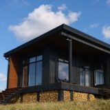 Black siding paired with natural wood