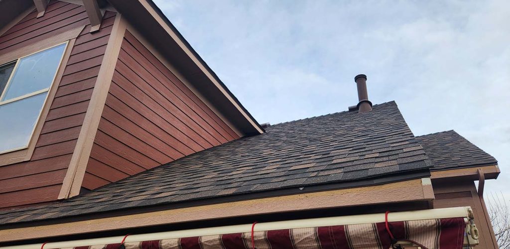Exterior roof maintenance by Custom Exteriors